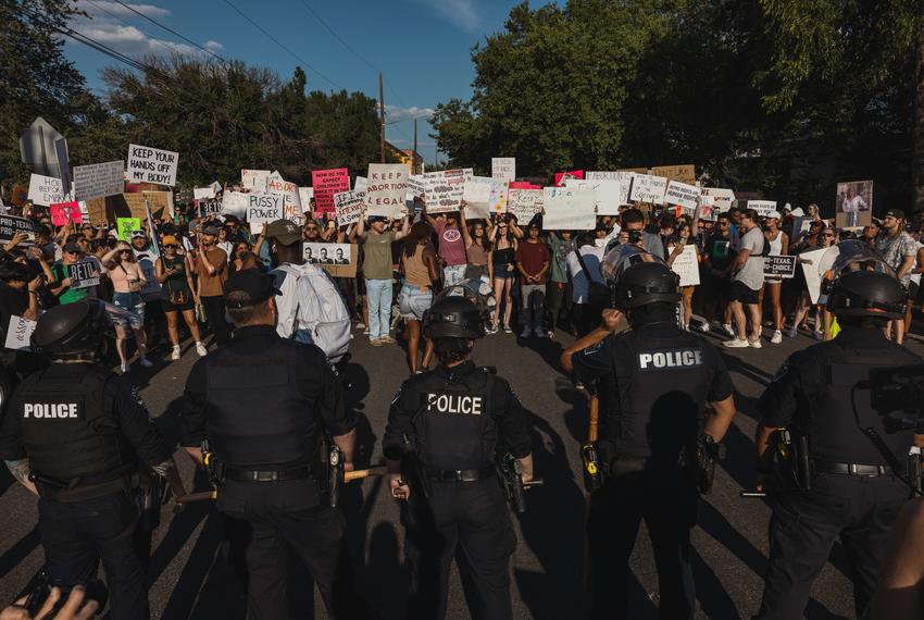 Police form a line to prevent protestors from walking down 3rd street at a rally for abortion rights in East Austin on Jun. 26, 2022.